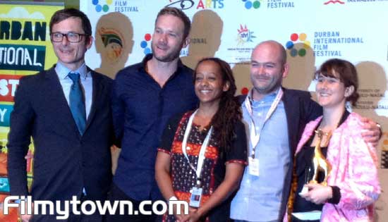 Jenna Bass left receives her award for SA Film at the 35th Durban International Film Festival.
